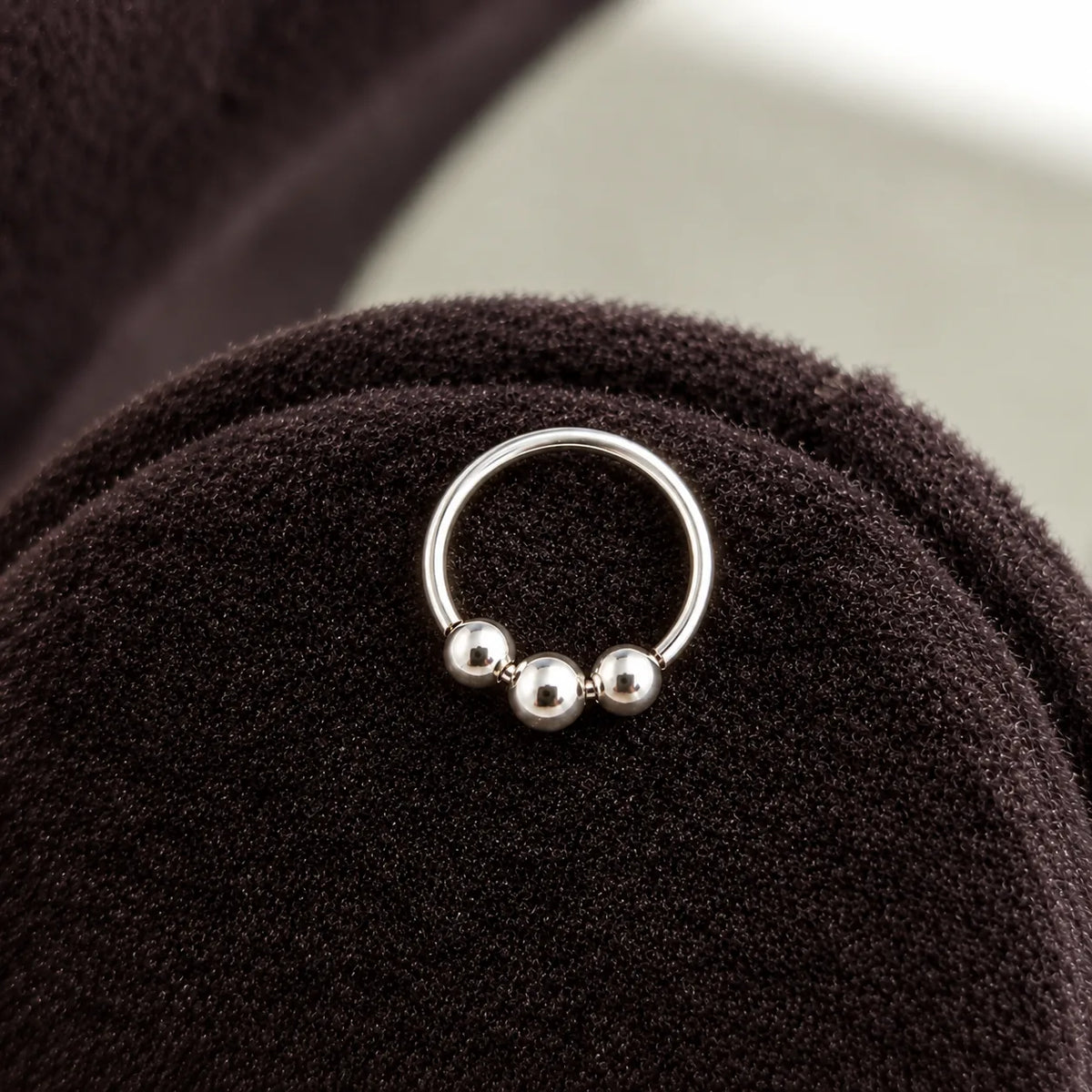 Silver Hoop Nose Ring with Triple Ball Bead Design