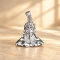 Silver Lord Shiva face pendant with crescent moon and detailed polished silver design on a warm beige background