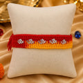 Silver Rakhi with Om Charm