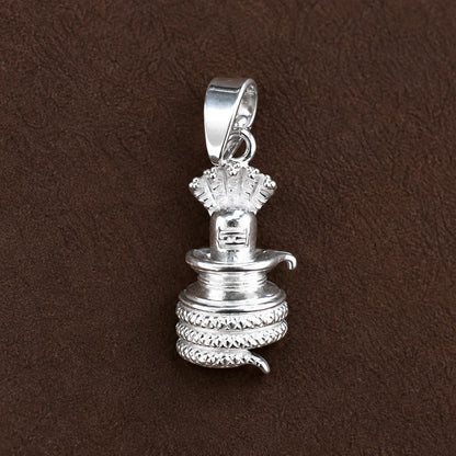 Silver Shivling pendant with cobra hood and coiled Naag design on a dark brown textured background