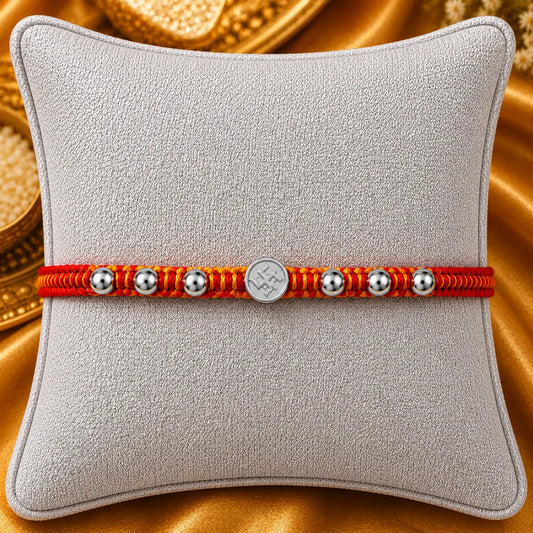 Silver Swastik Rakhi with Red and Yellow thread