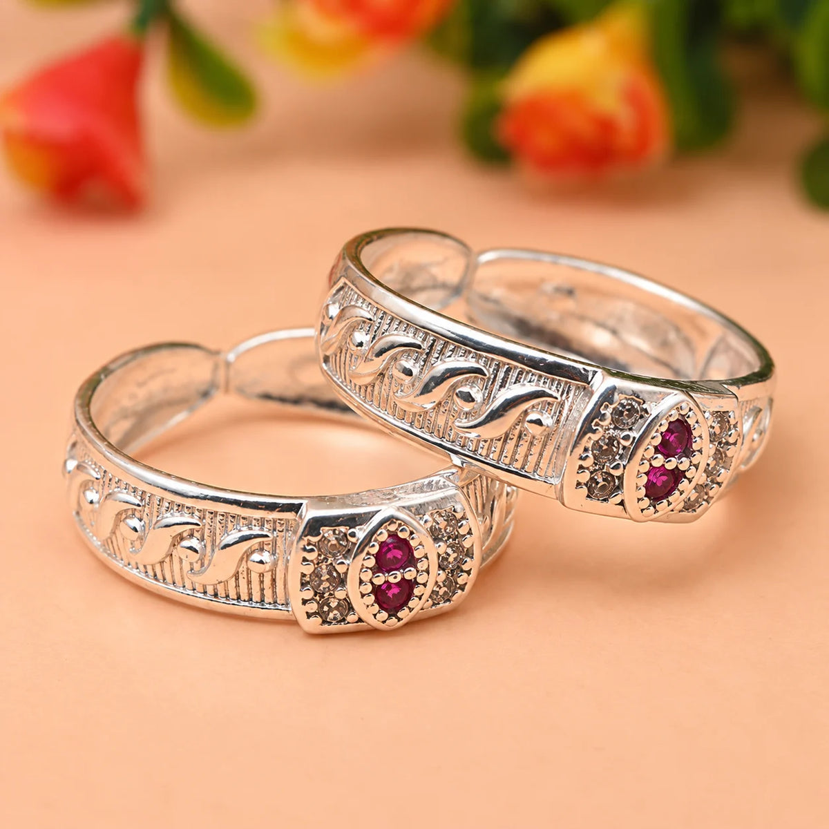 Silver Toe Ring with Intricate Detailing and Pink Stone