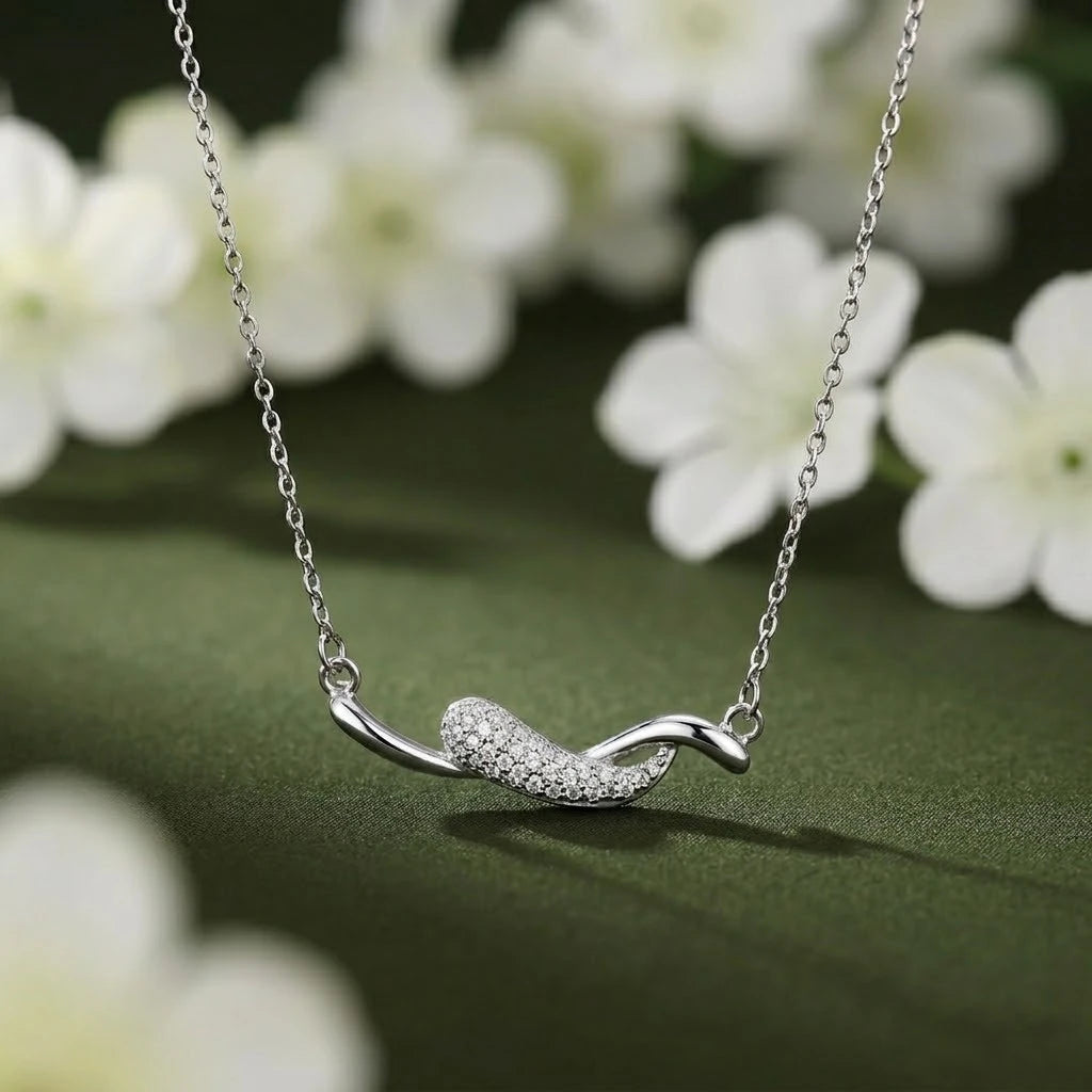 Sleek and Sophisticated Silver Chain Pendant with a Curved Design