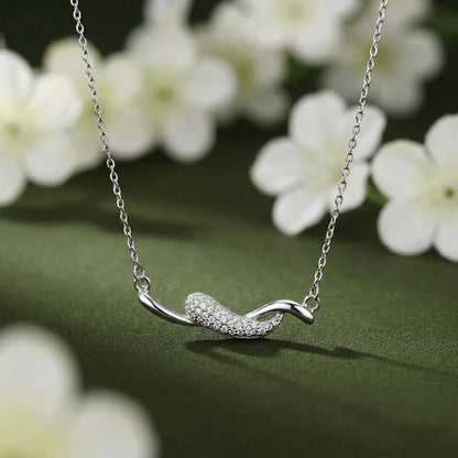 Sleek and Sophisticated Silver Chain Pendant with a Curved Design