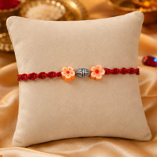 Sterling_Silver_Orange_Flower_Rakhi_For_Boys
