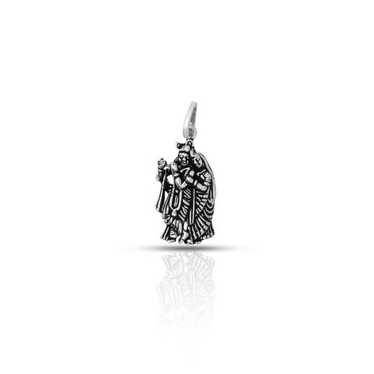 This sterling silver pendant features Radha Krishna, a beloved deity in Hinduism, playing a flute. Handcrafted with intricate detailing, this pendant showcases the skilled craftsmanship and devotion of the maker.