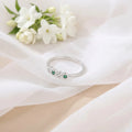 Sterling Silver Ring Featuring Alternating Green and White Stones