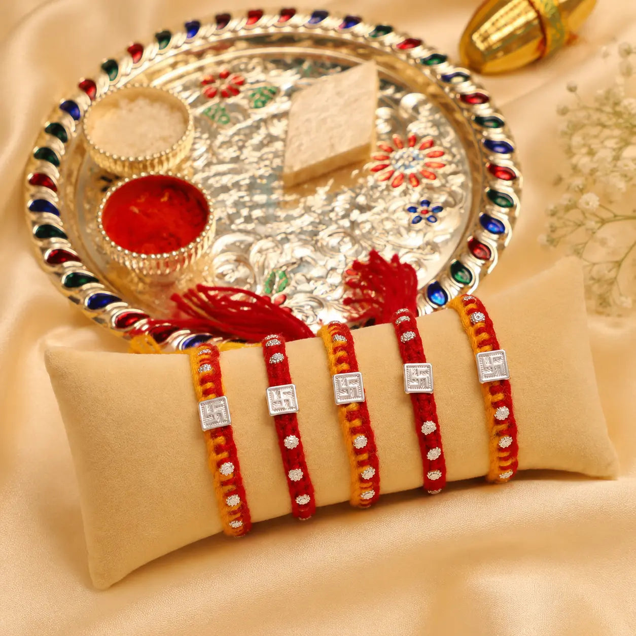 Swastik Glow Silver Rakhi Edition