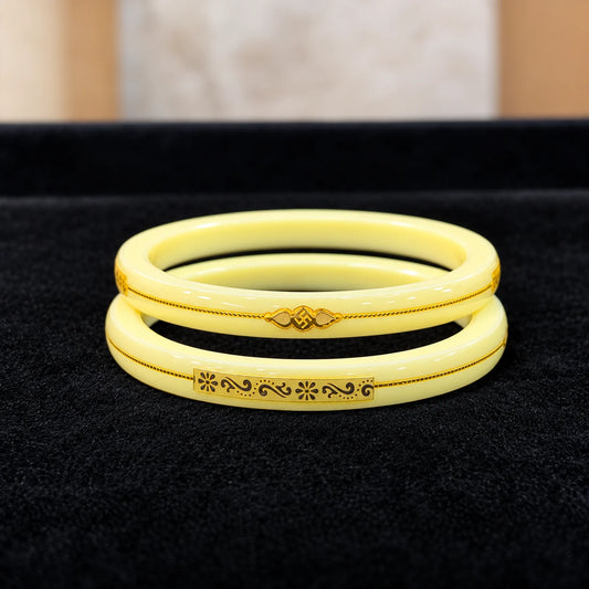 Yellow Designer Bangles with Elegant Golden Floral & Swastika Motifs