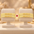 Yellow Designer Bangles with Elegant Golden Floral & Swastika Motifs

