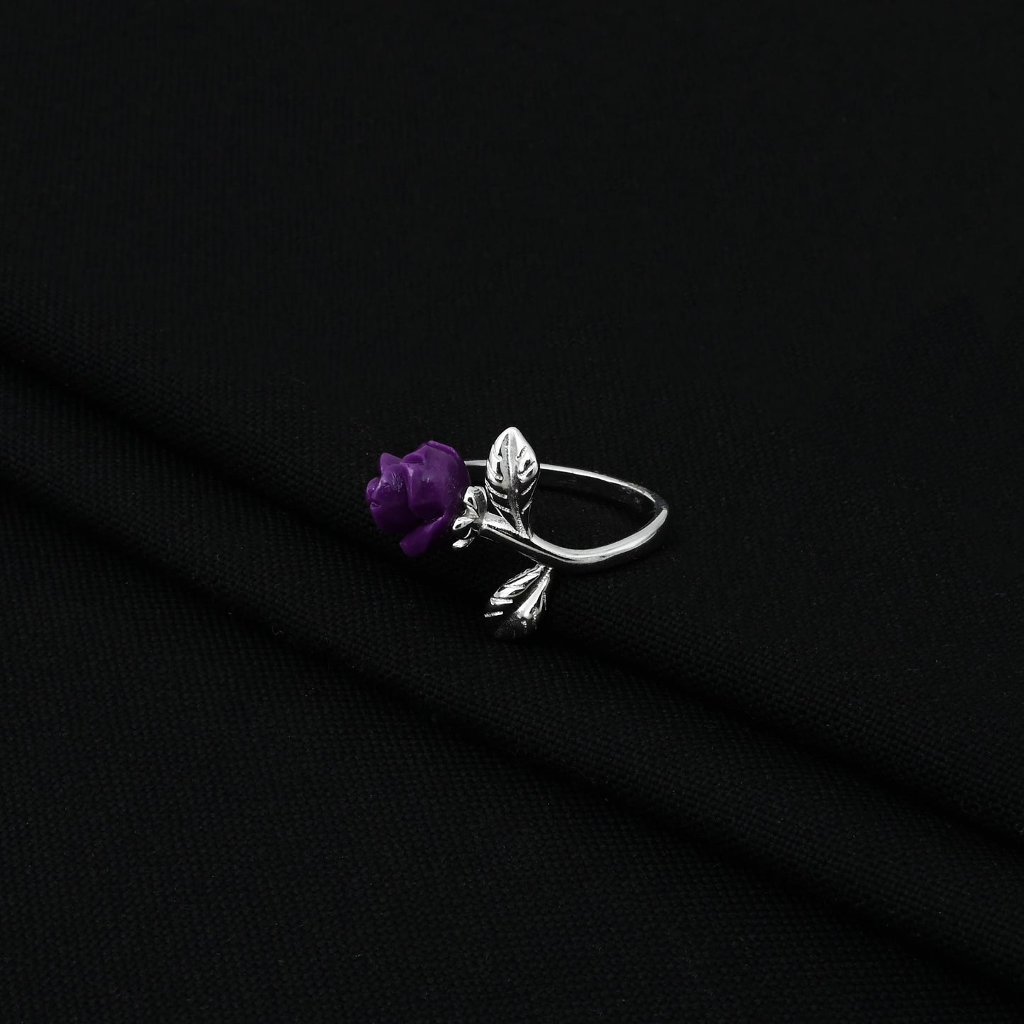 Elegant sterling silver ring for women showcasing a vibrant purple rose design.