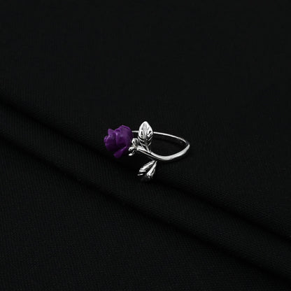 Elegant sterling silver ring for women showcasing a vibrant purple rose design.