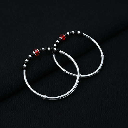 Stylish silver kada for babies with black and red bead design