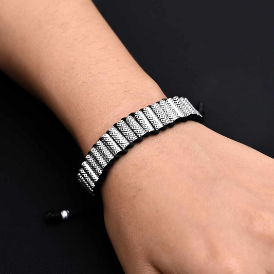 Men's silver bracelet featuring multiple cylinder-shaped silver beads