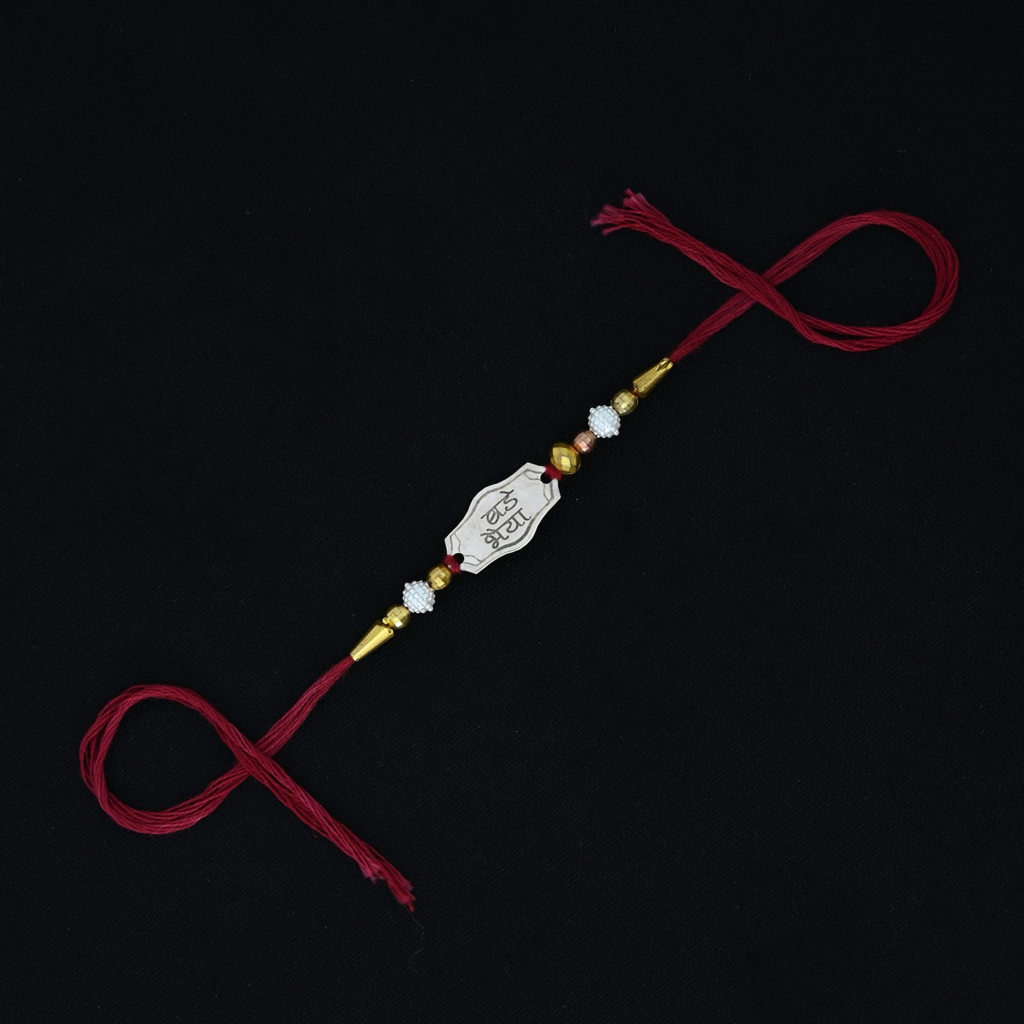 Personalized silver Rakhi with 'Bade Bhaiya' text, designed for boys