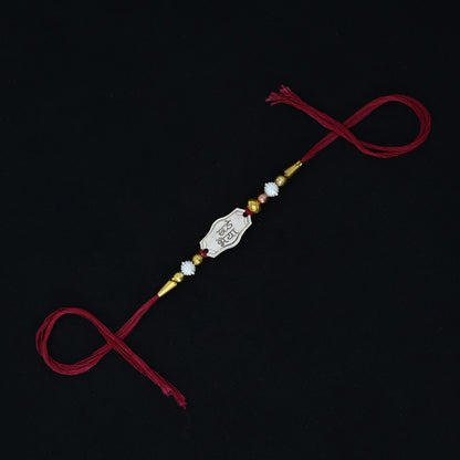 Personalized silver Rakhi with 'Bade Bhaiya' text, designed for boys