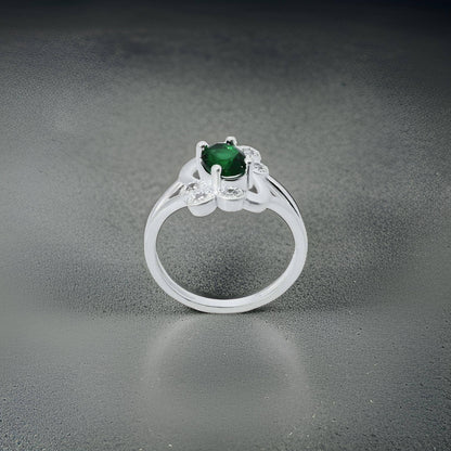 Elegant silver girls' ring with an oval green stone and intricate flower design