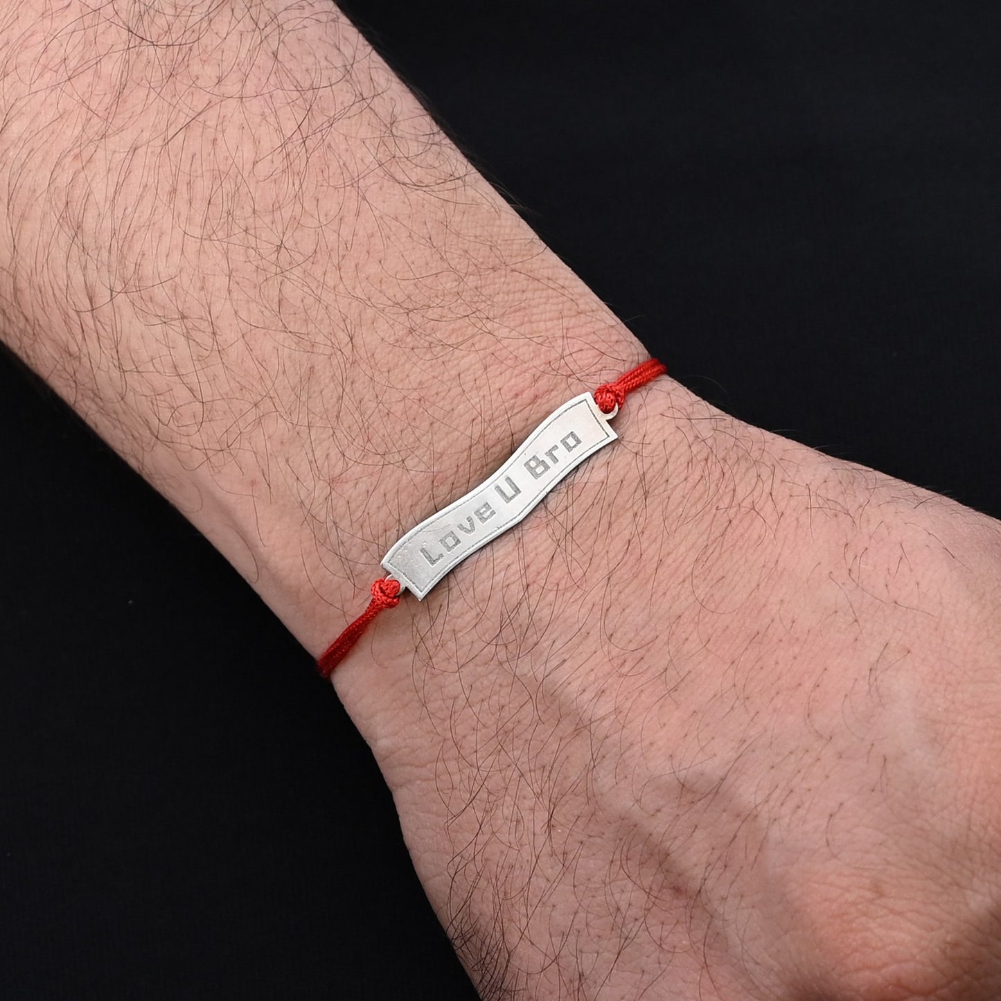 Elegant Rakhi with 'Love U Bro' in silver, ideal for boys