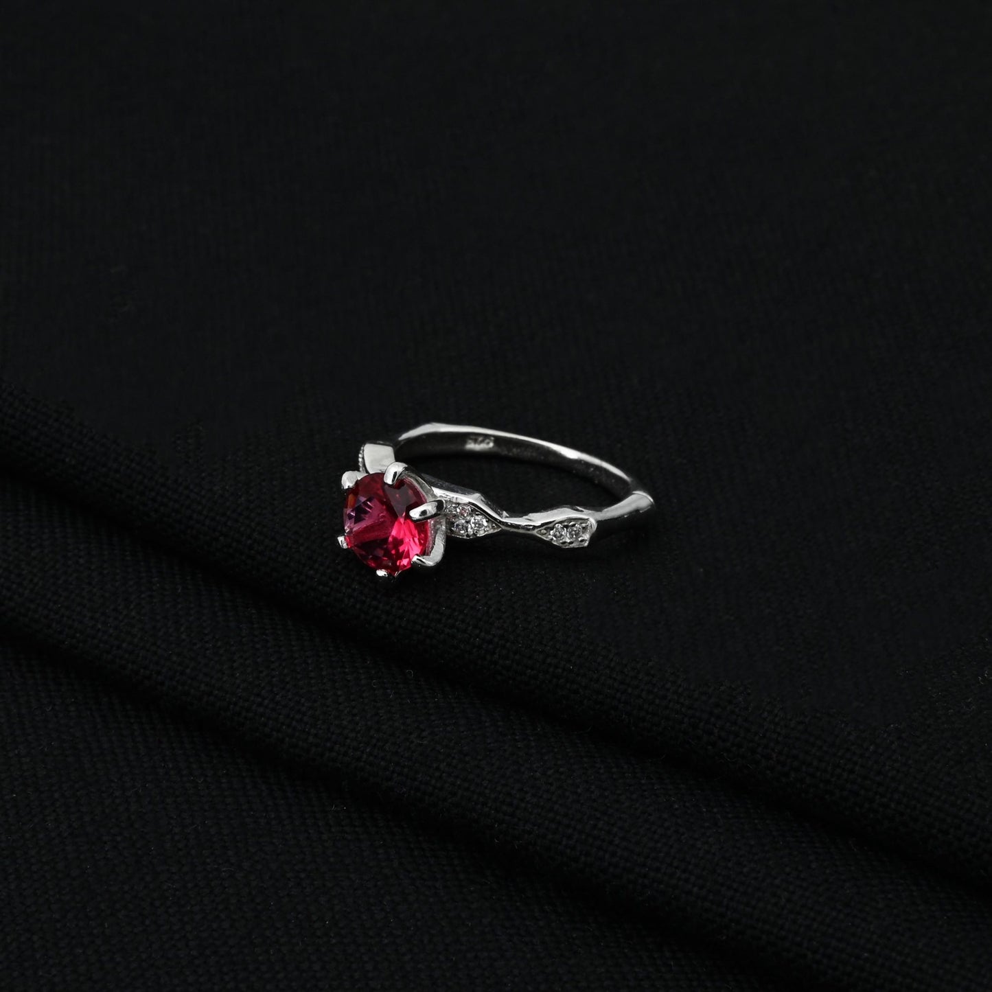 Sterling silver ring for girls, showcasing a striking blood red gemstone for a dramatic and feminine look.