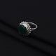 Stylish silver ring showcasing a vibrant green gemstone, perfect for a sophisticated and polished look.