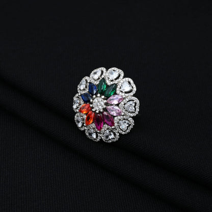 Elegant silver ring showcasing a vibrant floral design, combining colorful gemstones for a charming, nature-inspired look.