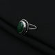 Stylish silver girls' ring showcasing a stunning green stone, designed to enhance your look with a touch of sophistication