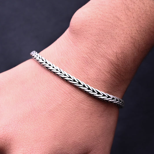 Men's oxidised silver bracelet featuring a bold lion symbol for a casual look