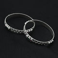 Stylish silver bangles showcasing a dynamic two-storm wave design
