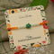 Silver Center Green Flower with Silver and Light Green Beads Rakhi for Boys