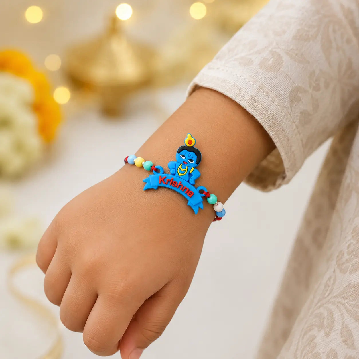 Cute Krishna Rakhi for kids with colorful beads and red thread