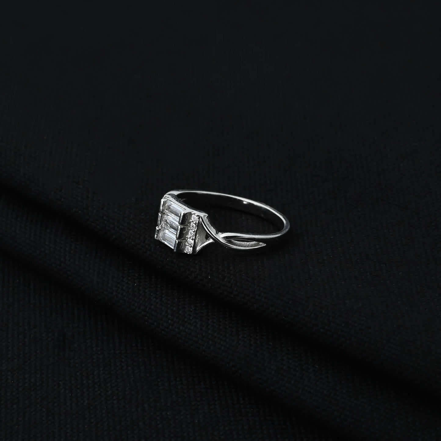 Stylish silver ring adorned with three rectangle stones.