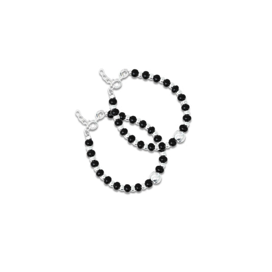 Elegant bracelet featuring black beads with a striking silver bead at the center for a bold look.