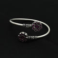 Silver kada featuring a dual flower design with intricate detailing