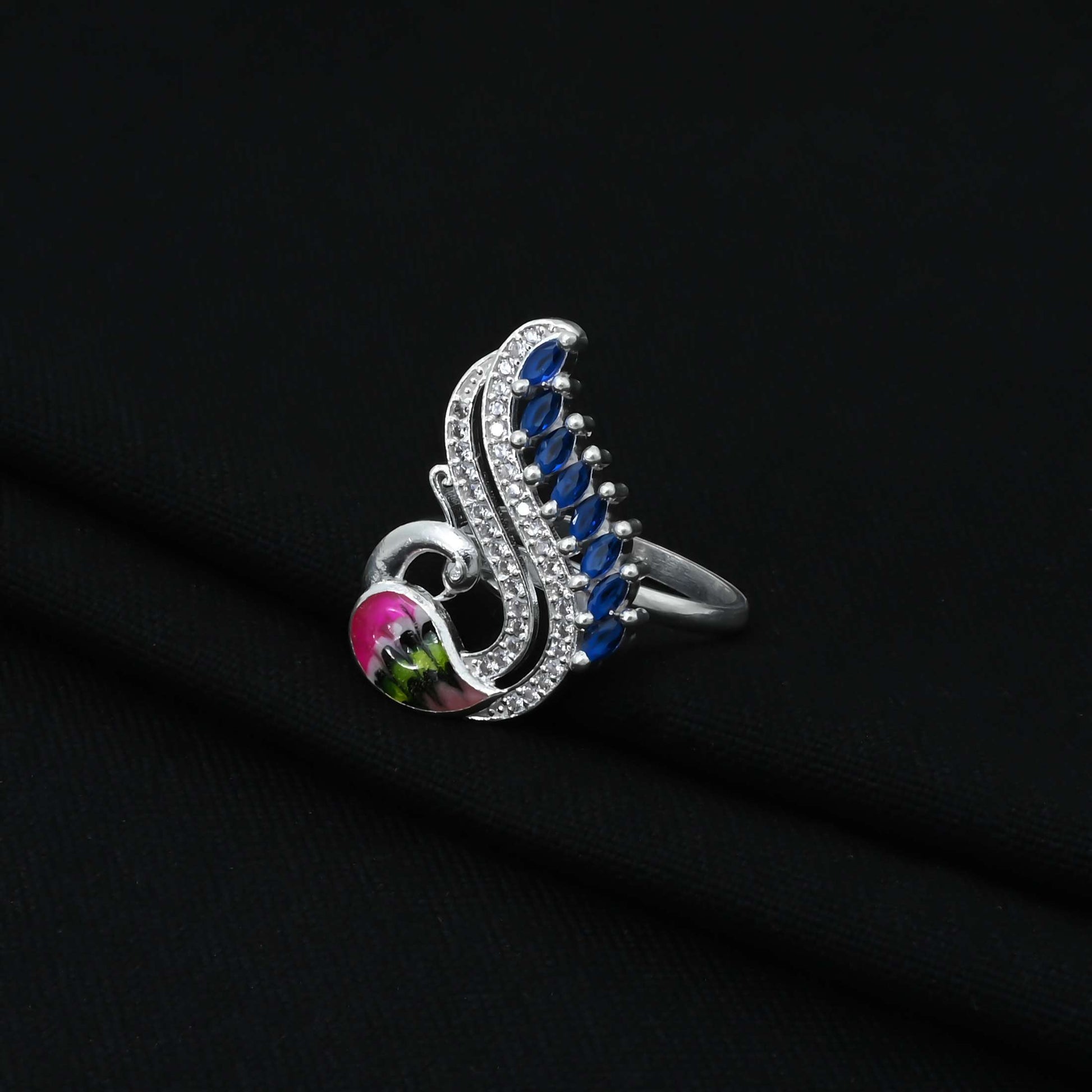 Stylish silver ring for girls showcasing a detailed peacock design.