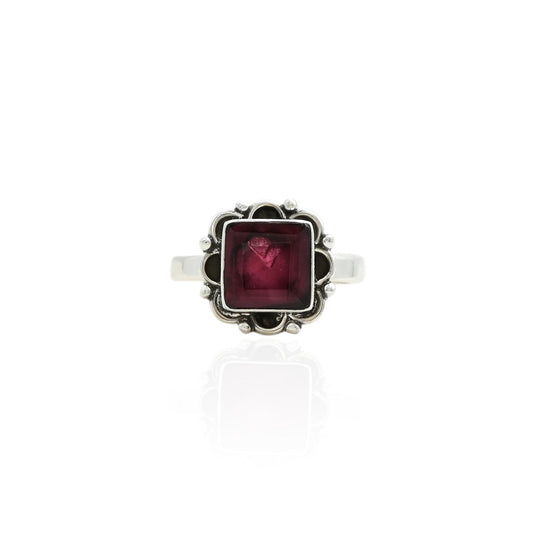 Silver ring featuring a stunning dark maroon gemstone, offering an elegant and rich look.