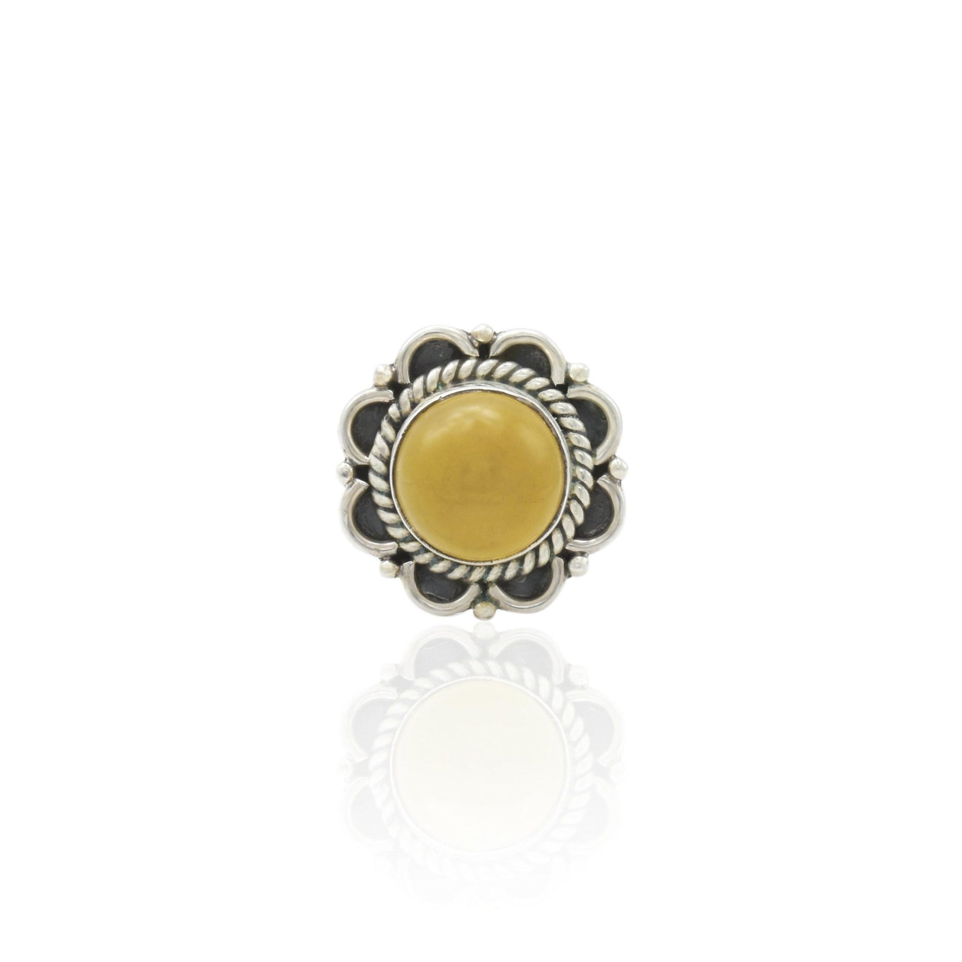 Silver ring featuring a radiant golden gemstone, offering an elegant and timeless accessory for her.