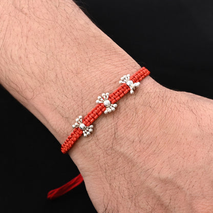 Elegant Rakhi with small silver beads, ideal for boys.