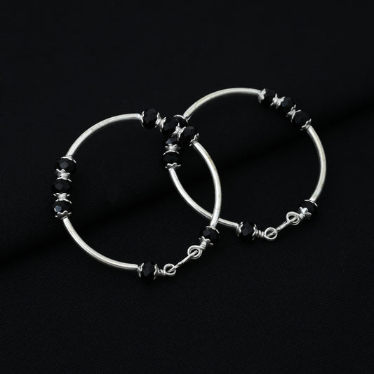 Charming silver baby kada adorned with black beads