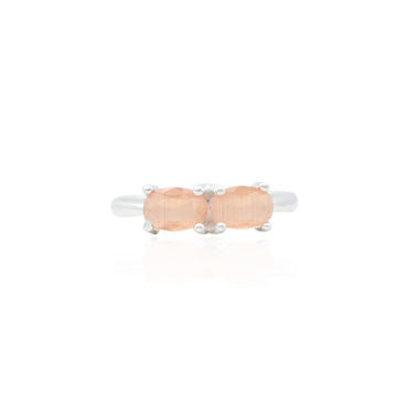 Silver ring featuring a glinting peach gemstone, offering a soft and elegant shine for a chic accessory.