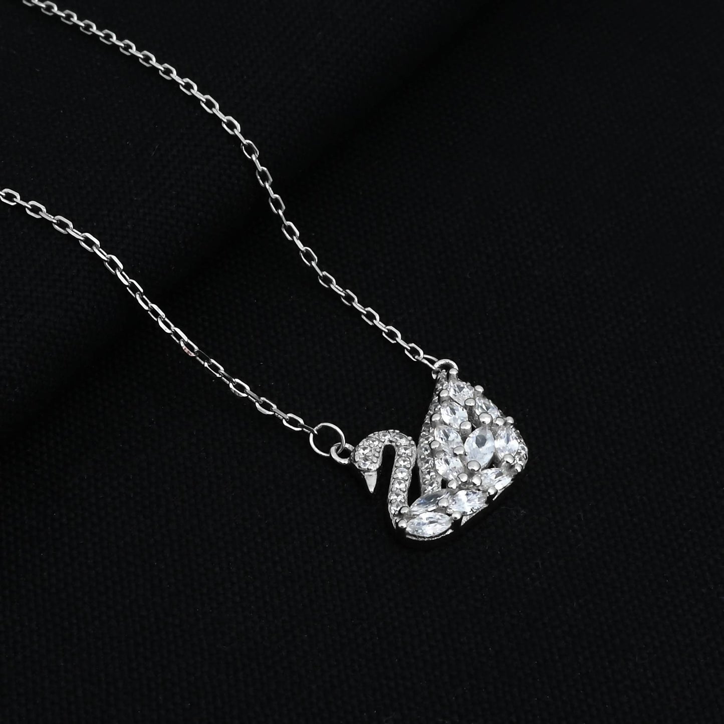 Silver chain with a duck-shaped pendant.