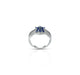 Elegant silver ring featuring blue flower design.