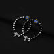 Trendy bracelet combining silver and black beads with an adorable blue teddy bear centerpiece