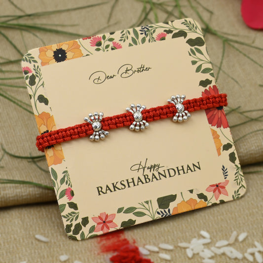 Silver Rakhi featuring small silver beads, perfect for boys.