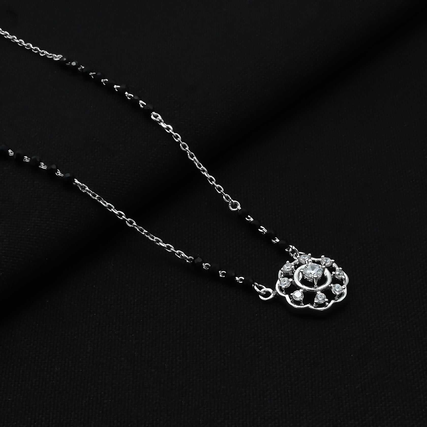 Stylish flower design pendant on a sterling silver chain.