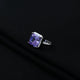 Elegant silver ring showcasing purple square stone design.