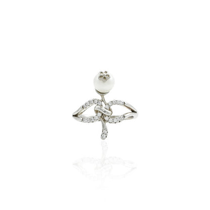 Silver ring featuring a delicate flower design with a pearl center.