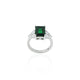 Close-up of a silver ring with a stunning emerald green gemstone, perfect for adding a touch of luxury and elegance.