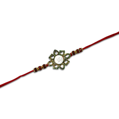 Boys' Rakhi featuring a silver Swasthik flower centerpiece with vibrant multi-color beads.