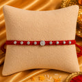 Silver Swastik Rakhi with Red Thread