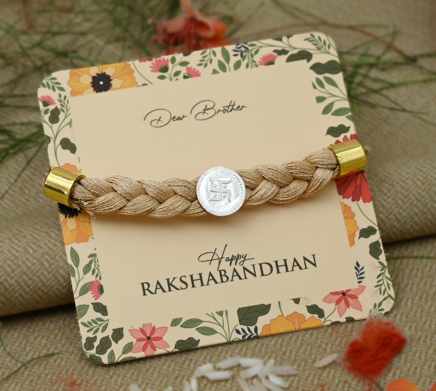 Silver center Swastik design with cream tangle Moli, perfect Rakhi for boys